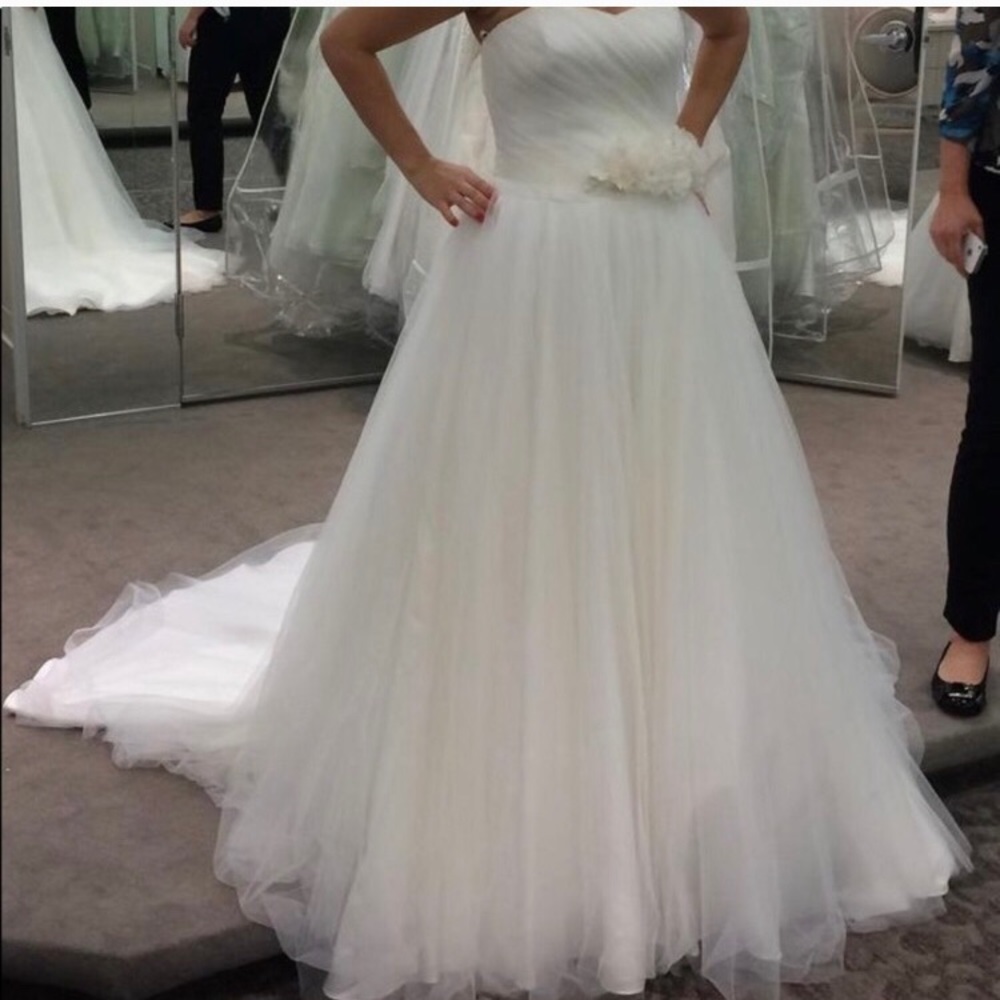 Wedding dress used once no stains/tears. Size 12